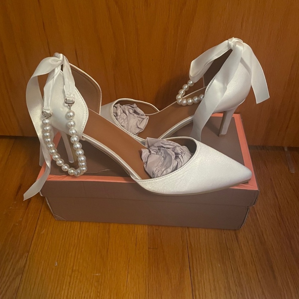 White pearl and bow heels